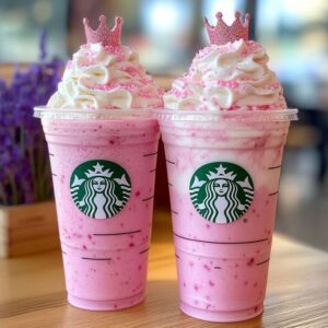 Pink princess frappuccino with whipped cream and sprinkles