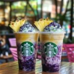 Blueberry pineapple swirl frappuccino with whipped cream