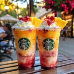Malibu Sunset Frappuccino in a glass with whipped cream and cherry garnish