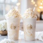 Creamy heavenly vanilla cloud frappuccino with whipped cream and white chocolate drizzle