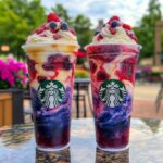 Triple berry sunrise frappuccino with red, purple, and golden layers