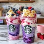 Berry banana Frappuccino with whipped cream and fresh fruit