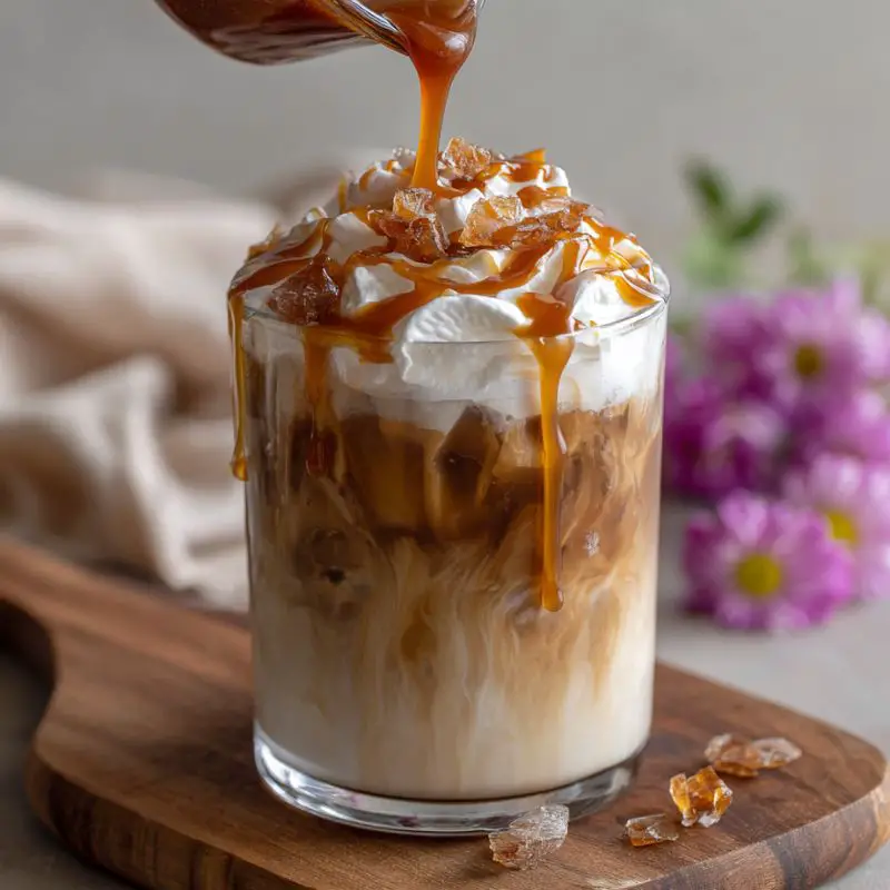 Burnt caramel smoke Frappuccino with whipped cream and burnt sugar shards
