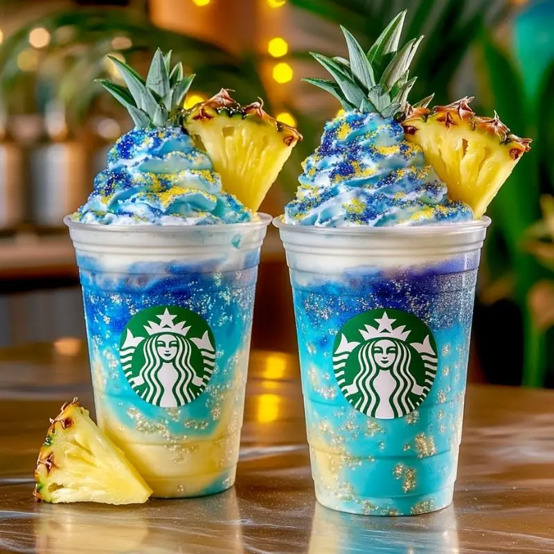 Blue Pineapple Shockwave Frappuccino with whipped cream and galaxy syrup drizzle